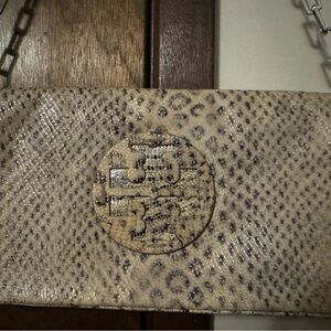Tory Burch animal print clutch purse.